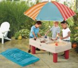 sand and water table with umbrella