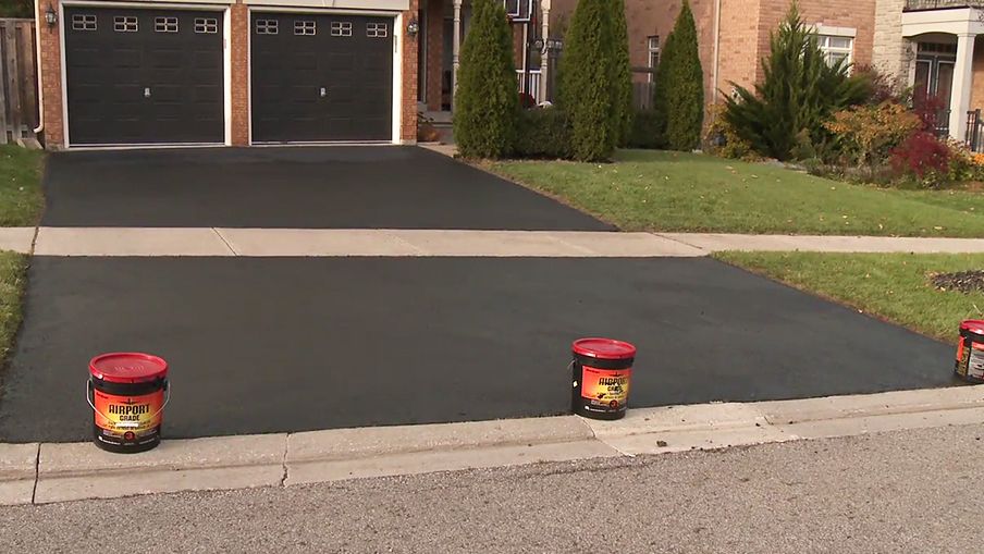 Use empty pails to prevent cars from parking on the fresh sealer