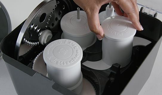 A food processor with a storage case.