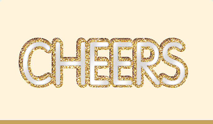 A standing MDF mirrored “Cheers” decorative sign with a gold glitter outline around each letter.