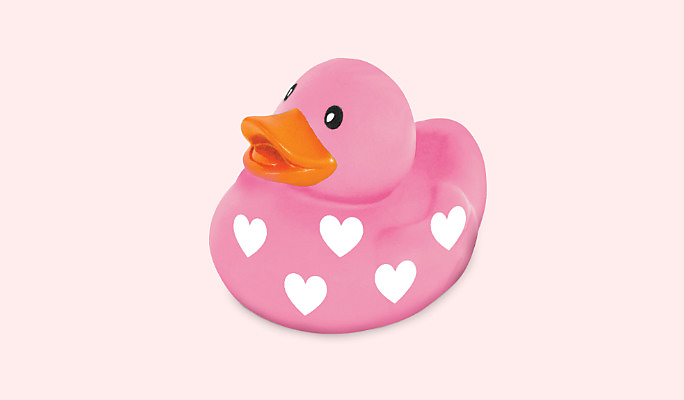 A Valentine&#39;s Day pink rubber duck with a white heart print.