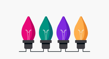 Four Christmas light bulbs in magenta, teal, purple and orange.