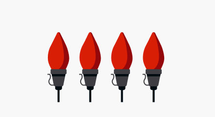 Four red C7-style Christmas light bulbs with black bases.