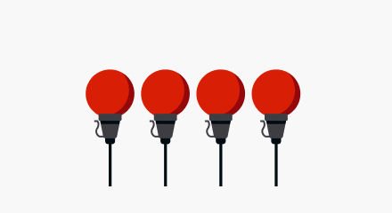 Four red globe-shaped Christmas light bulbs with black bases.