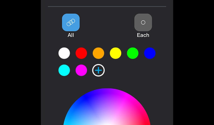NOMA Smart app interface displayed on a smartphone screen, featuring a colour wheel, customizable lighting controls and colour selection options for creating personalized holiday light displays.